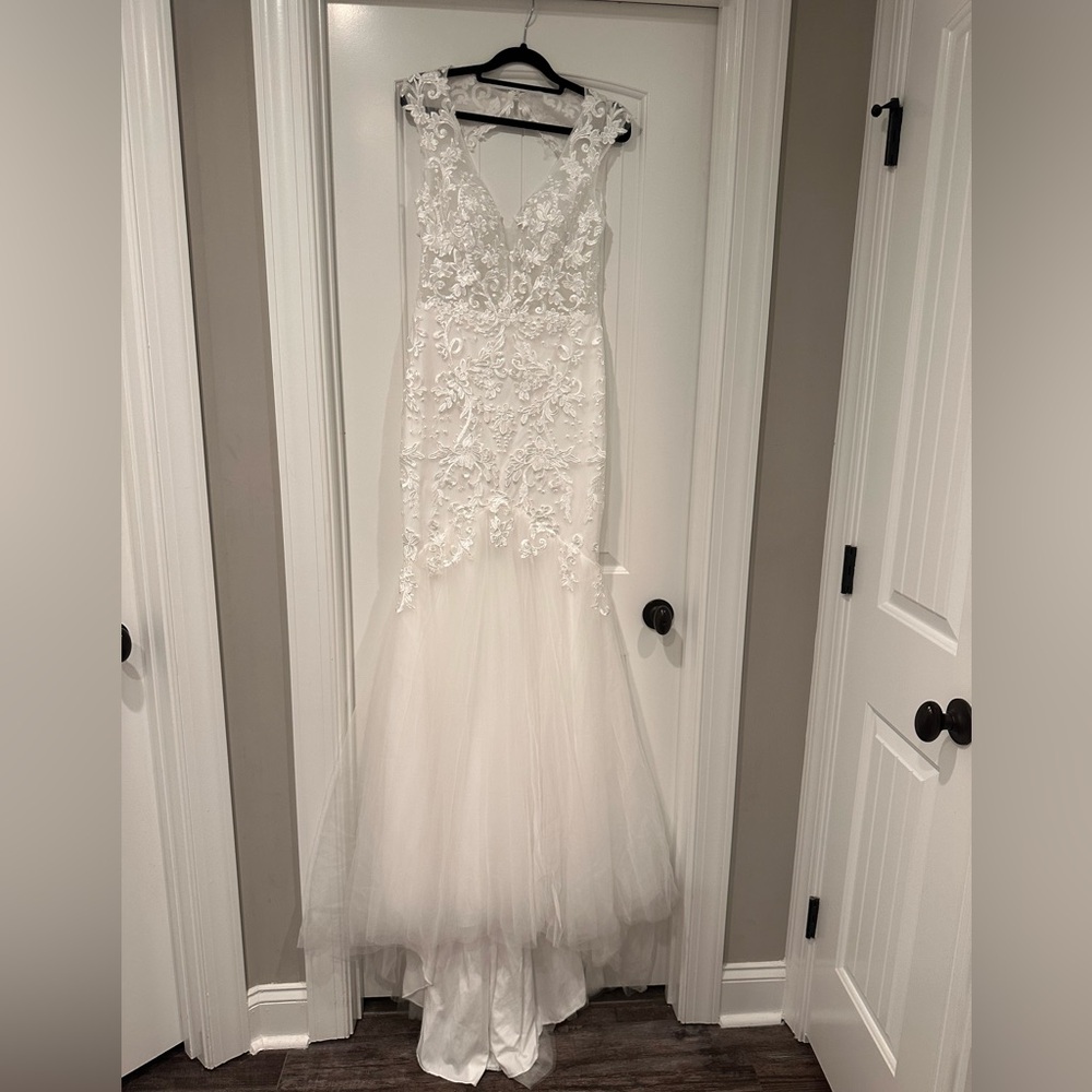 Wedding dress size 8, fits more like a 6. But has room in it.